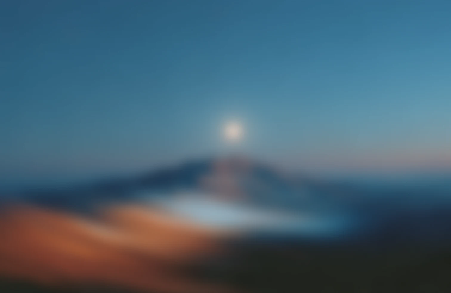 Calm blue-hour mountain landscape at dusk