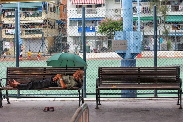 Outdoor benches beside a sports court; the training record asks whether a chair is visible.