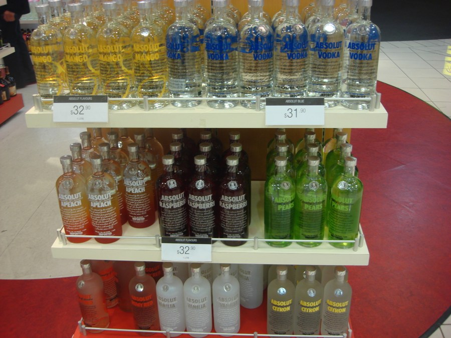 Shop shelf with mango vodka and a price label of 32.90.